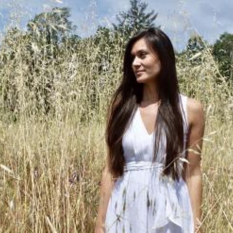 Erica Tom in a tall wheat field 